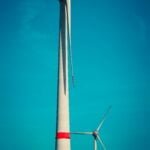 a large windmill with a blue sky