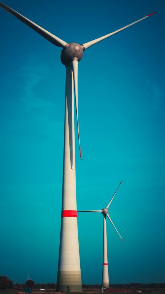 a large windmill with a blue sky