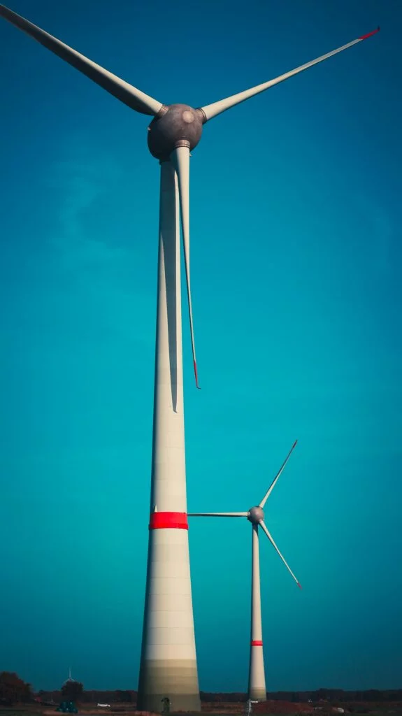a large windmill with a blue sky